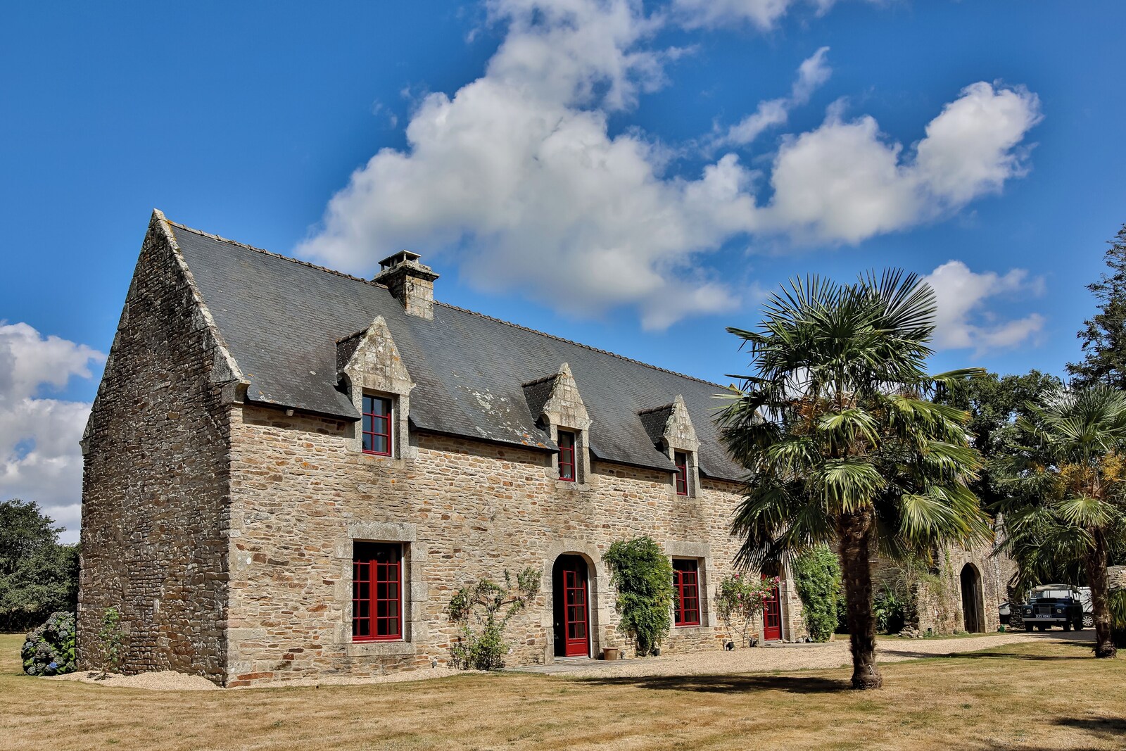 Le Cholo's stone façade and red-framed windows